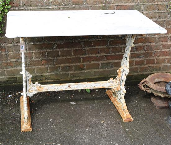 A Victorian cast iron table base with later white marble top